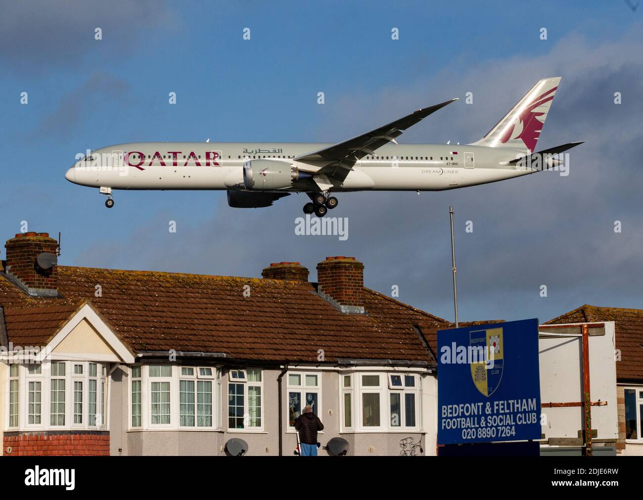 A Qatar Airways airplane coming in to land at Heathrow airport. Stock Photo
