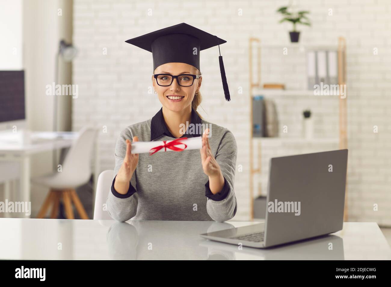 Girl holding award certificate hires stock photography and images Alamy