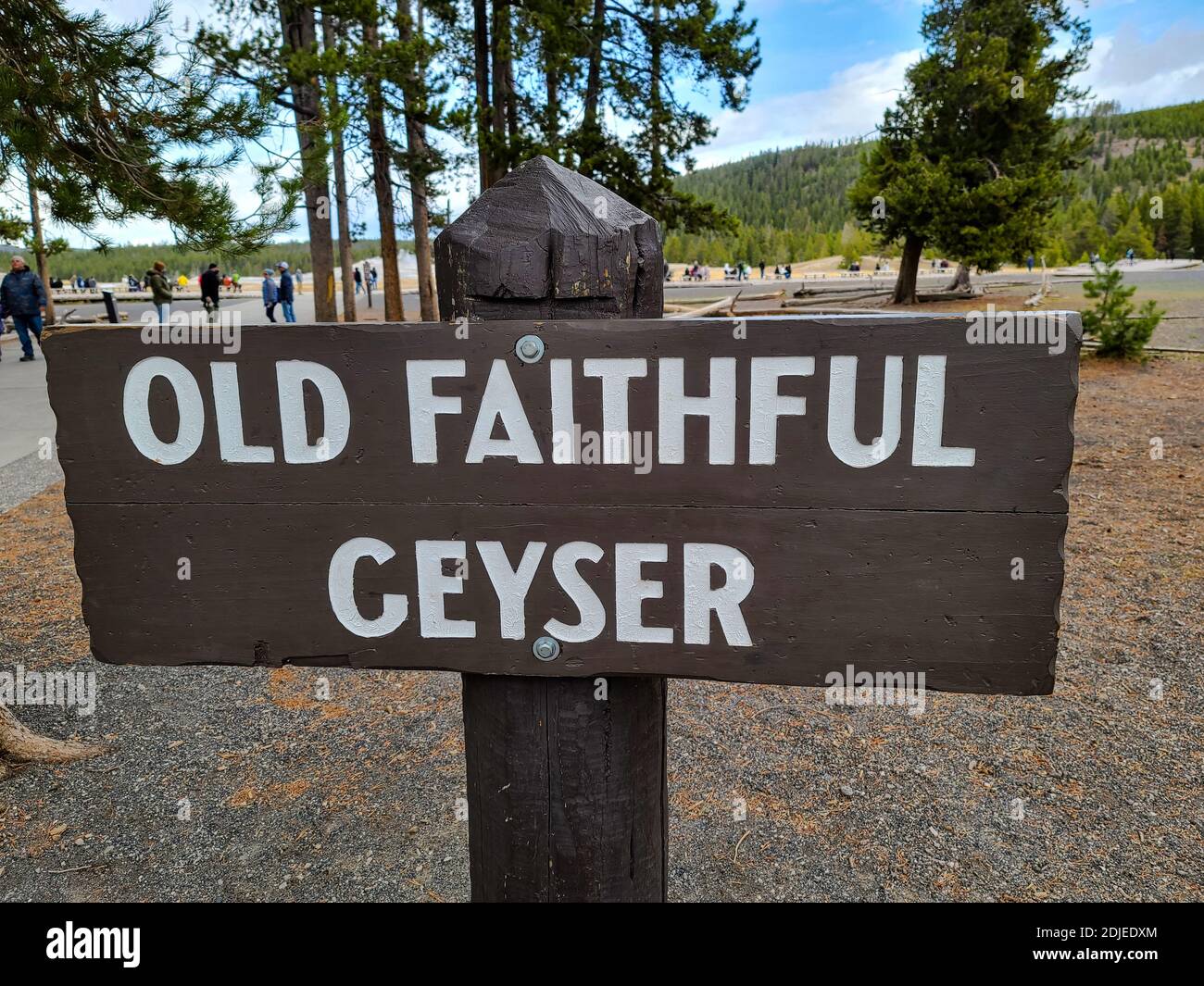 Old Faithful Geyser sign at the popular tourist attraction in Yellowstone National Park, Wyoming Stock Photo