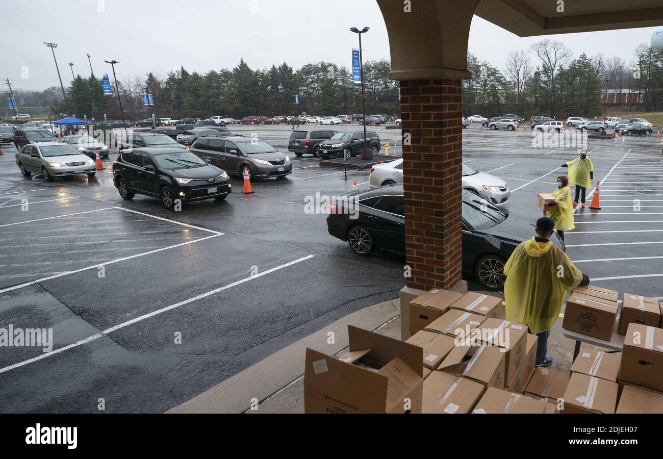 Washington, United States. 14th Dec, 2020. Volunteers with the Farmers to Families Food Box Program distribute food to needy individuals at Christ Church in Woodbridge, Virginia on Monday, December 14, 2020. Photo by Kevin Dietsch/UPI. Credit: UPI/Alamy Live News Stock Photo