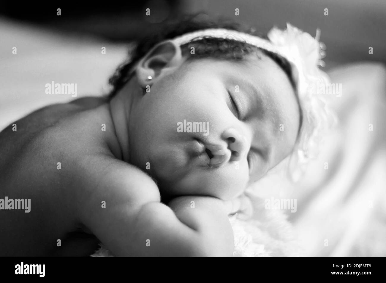 Sleeping newborn baby on bed Black and White Stock Photos & Images Alamy