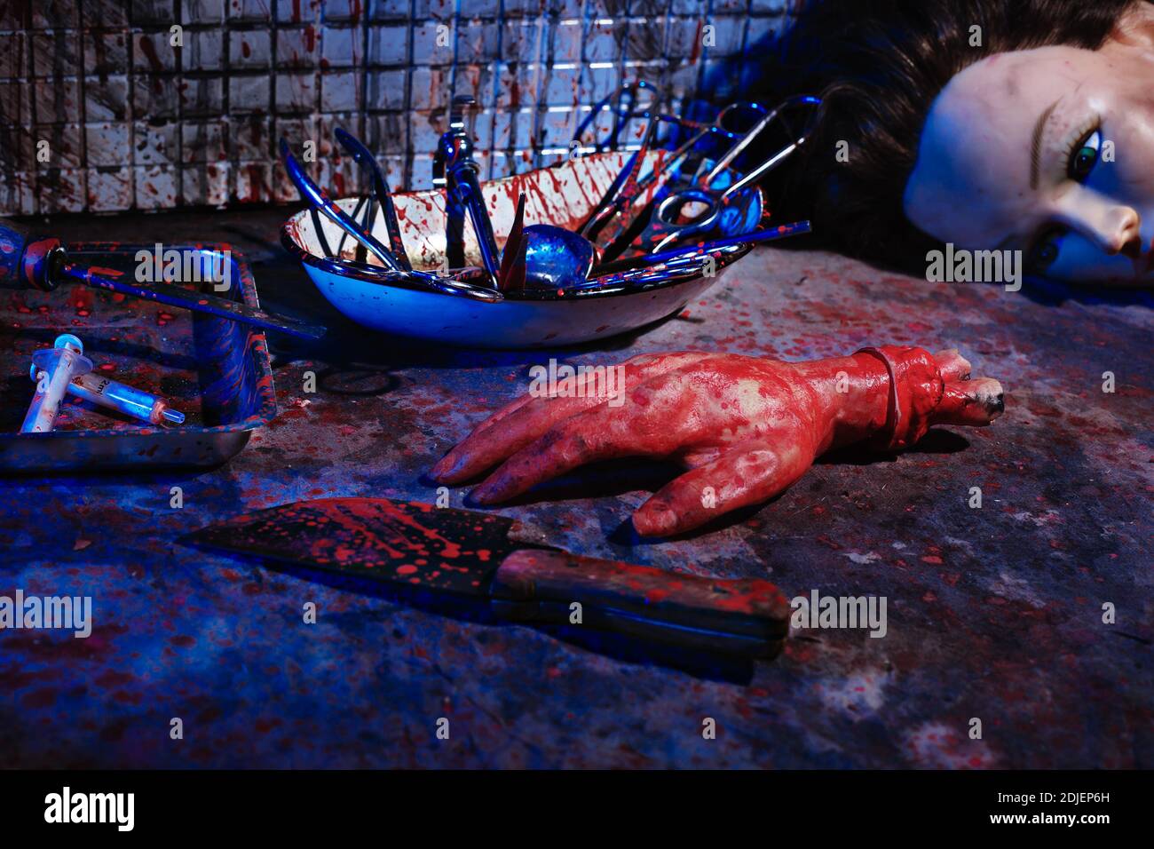 Human limbs and remains are covered in blood. Creepy and gloomy room for medical experiments Stock Photo