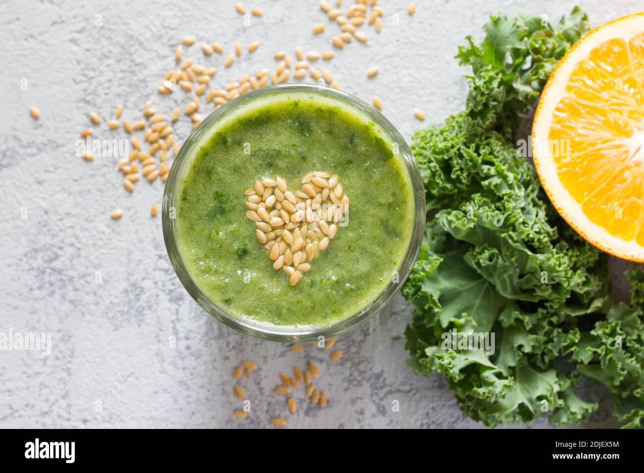 Healthy green smoothie with heart of seeds linseed Stock Photo