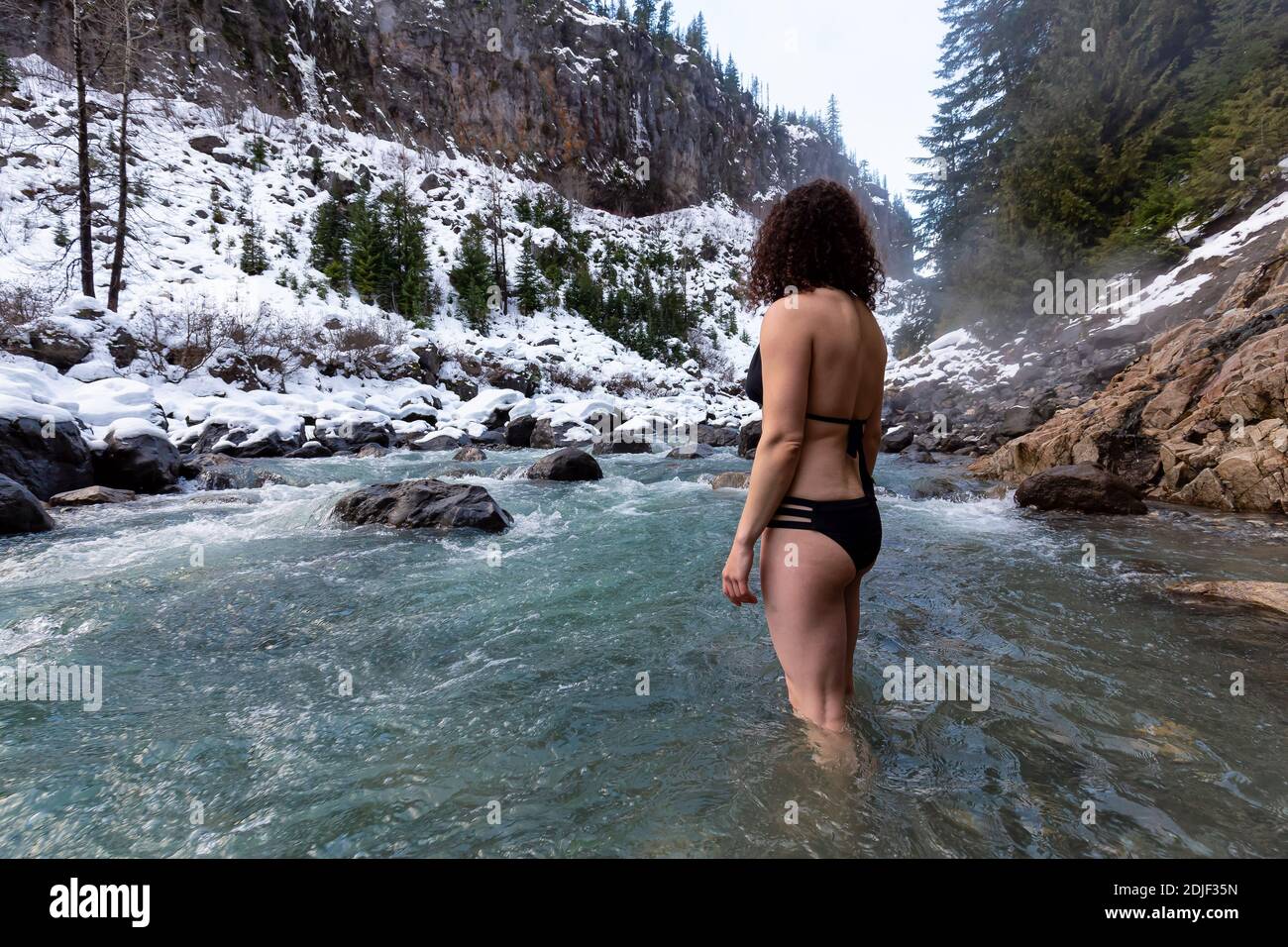 Caucasian Girl swimming in the Ice Cold Freezing Glacier River Stock Photo  - Alamy