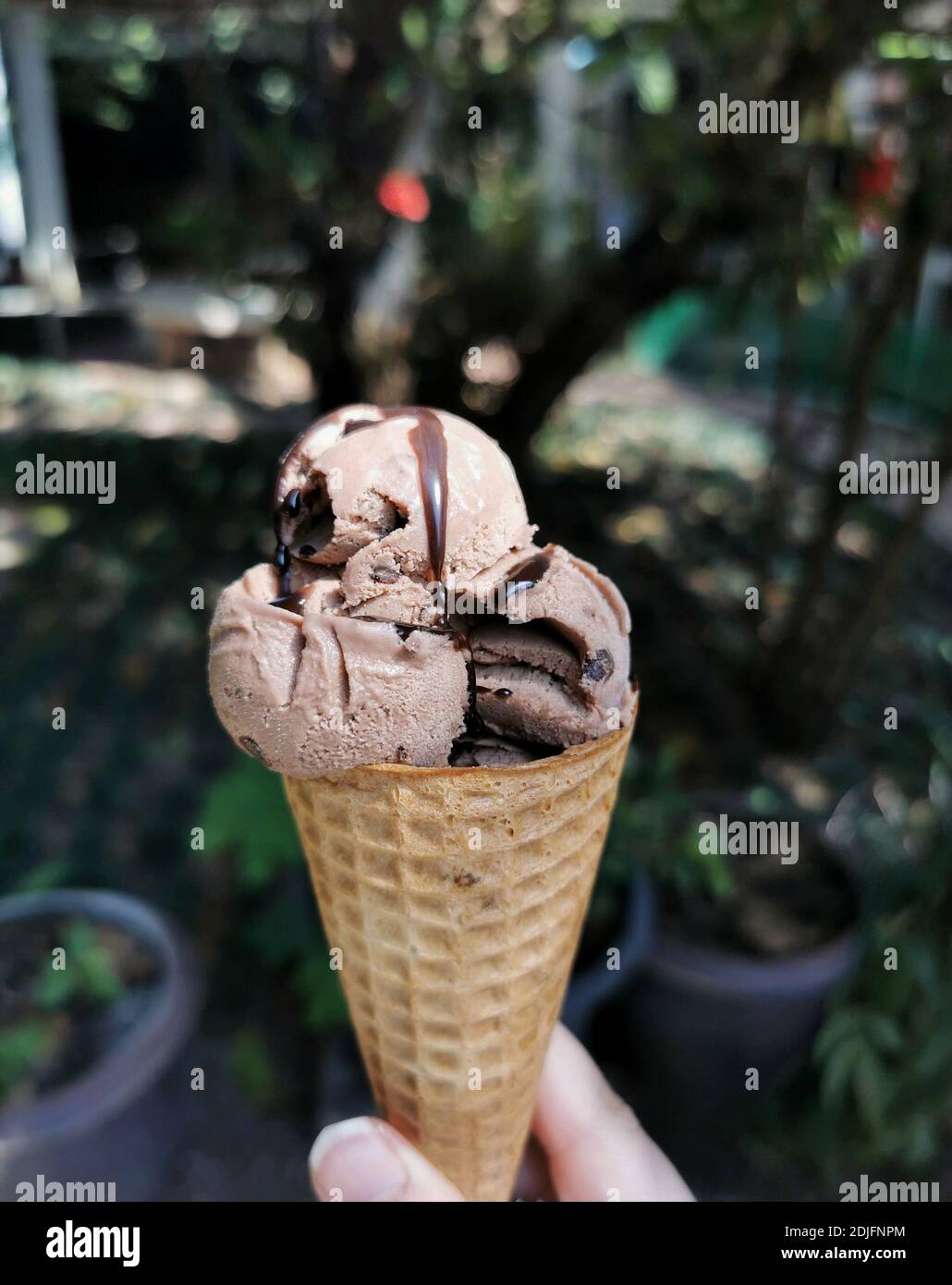 Close-up Of Hand Holding Ice Cream Cone Stock Photo - Alamy