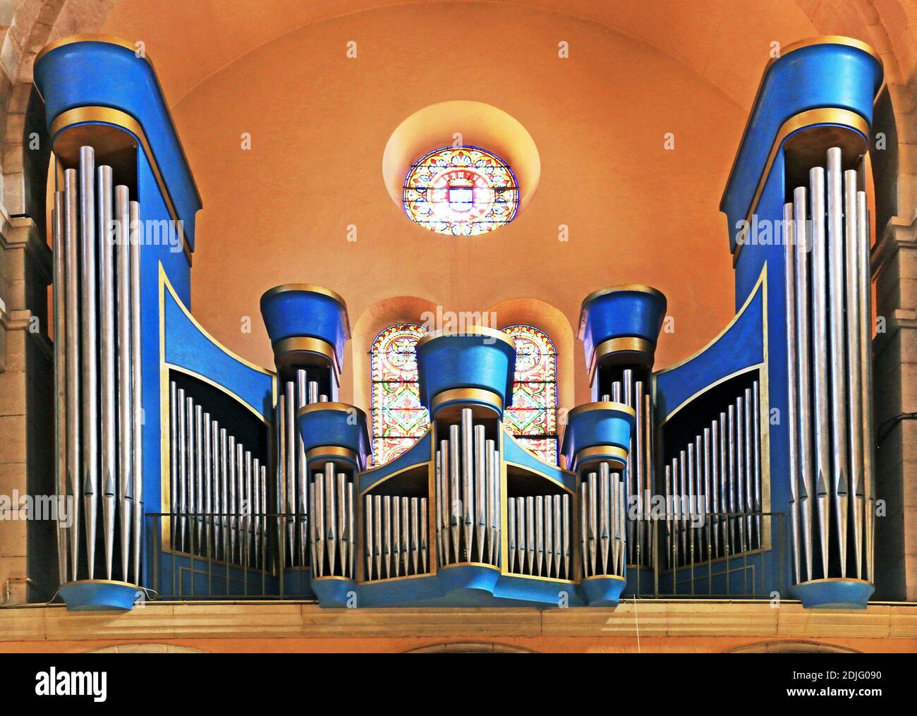 Large church organs in a colorful baroque style. Stock Photo