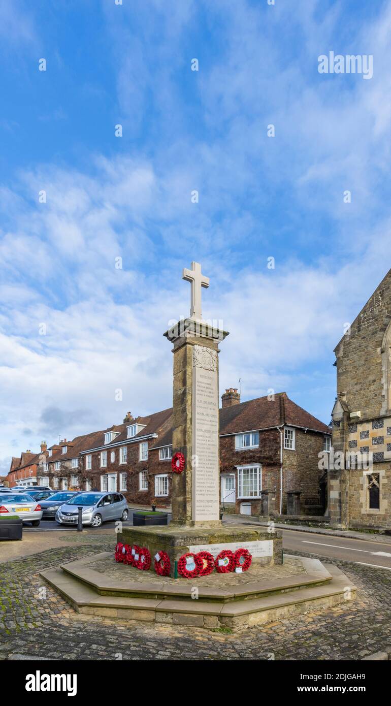 Poppy wreaths laid at the base of the war memorial in Church Hill, Midhurst, a town in West Sussex, south-east England Stock Photo