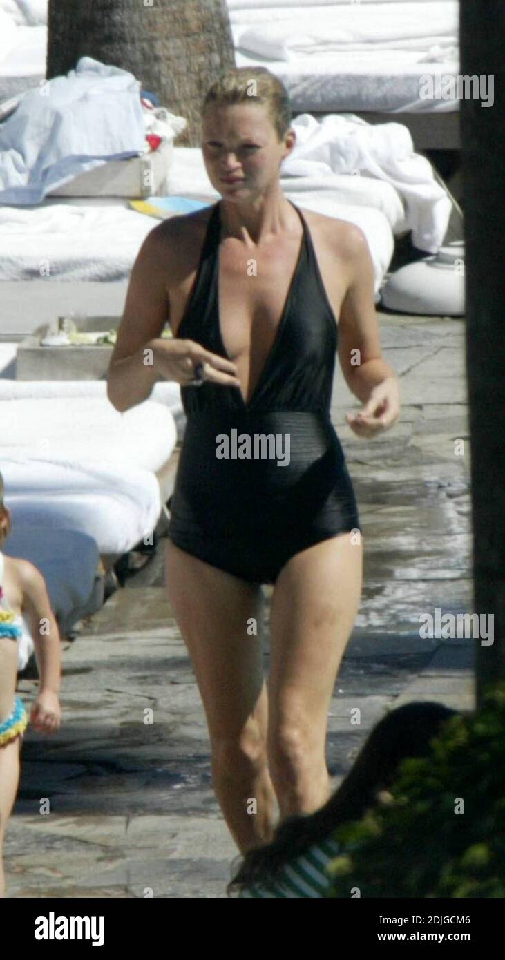 Exclusive!! For a second day running Kate Moss has a bikini malfunction  showing off a little too much skin as she spends a day poolside with  daughter Lila Grace and Mother Linda