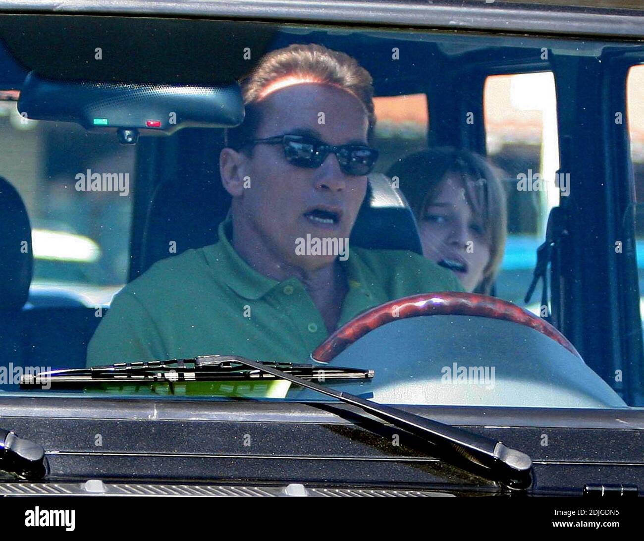 Exclusive!! Arnold Schwarzenegger takes his son Patrick out for another weekend spin, this time without any accidents and trading in his motobike for a Mercedes G500 or as nick-named by the Governor's plate,  his G WAGEN. Malibu, Ca. 1/22/06 Stock Photo