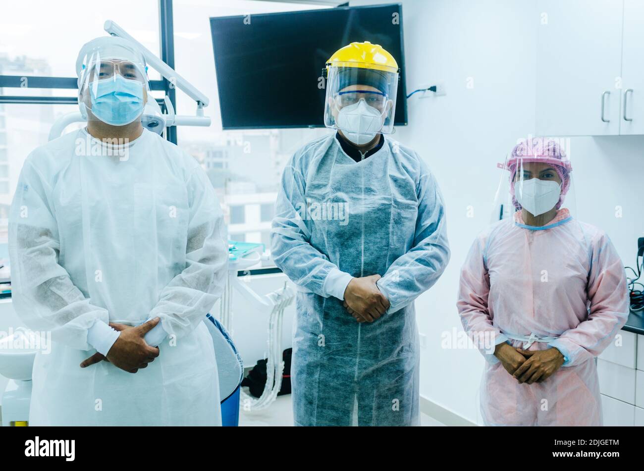 A group of doctors in protective suit against the virus Stock Photo