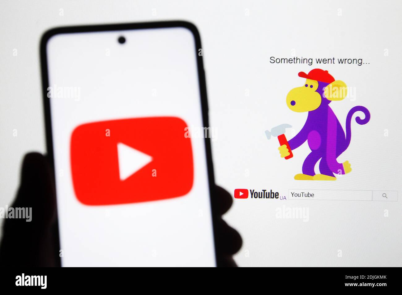 Ukraine. 14th Dec, 2020. In this photo illustration a Youtube logo seen displayed on a smartphone. Users reported about the problem and outage in the youtube app, Users were experiencing a blank page with error messages reading 'something went wrong' accompanied by a monkey holding a hammer in the YouTube video service, but later the issue seems to have been fixed. The problem mainly affected the European region, as well as the east coast of the United States, Japan, Australia, and Malaysia. Credit: SOPA Images Limited/Alamy Live News Stock Photo