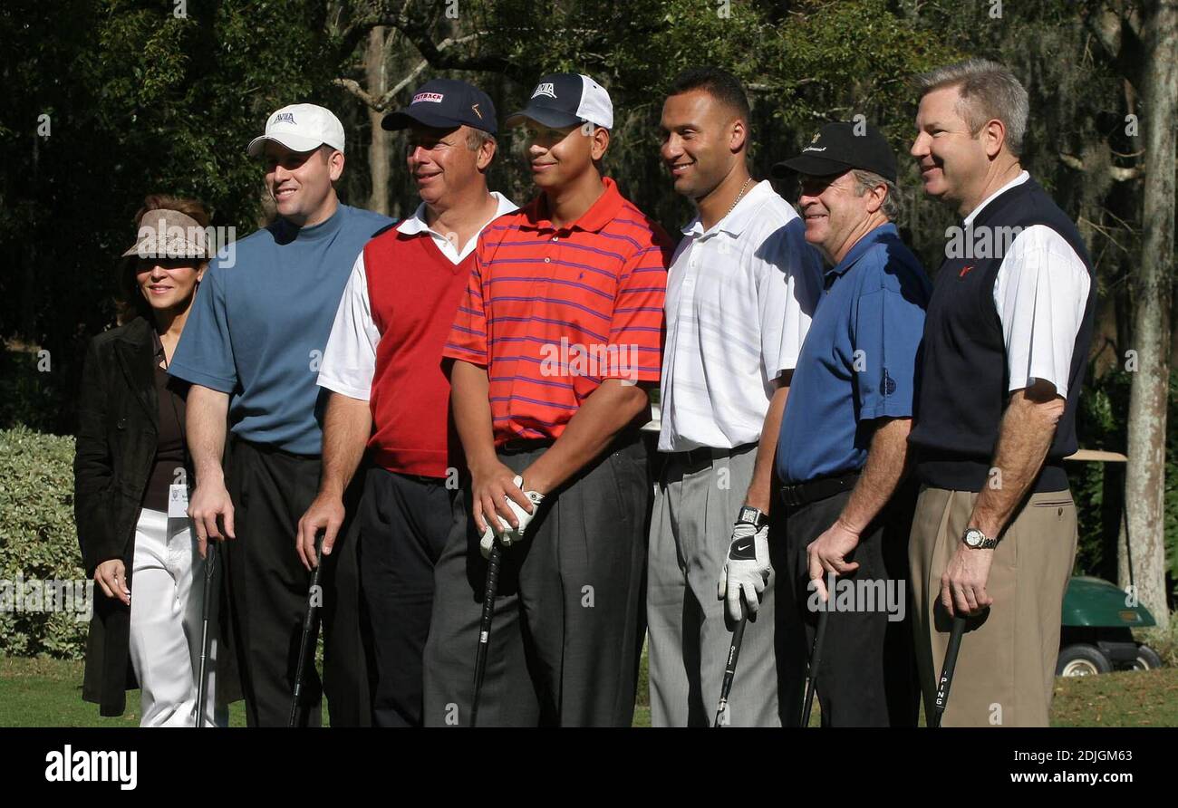 Derek Jeter, center white, and Alex Rodriguez, center, red stripe, play golf with some high paying businessmen to benefit the Turn 2 foundation celebrity golf tournament in Tampa on Monday.  1/16/06 Stock Photo