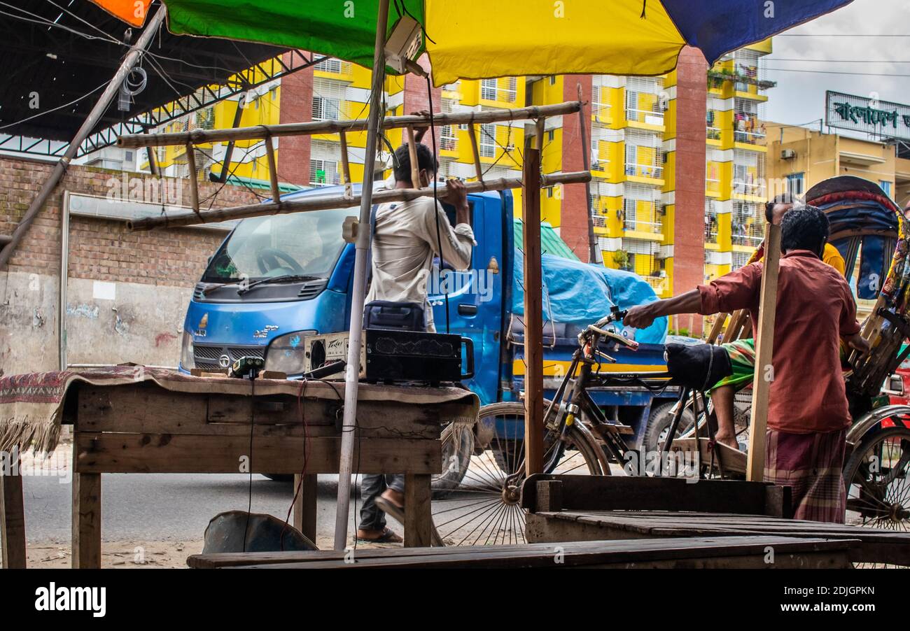 Hard working men moving motion on the city street. I captured this image from Asia, Dhaka, Bangladesh. Stock Photo