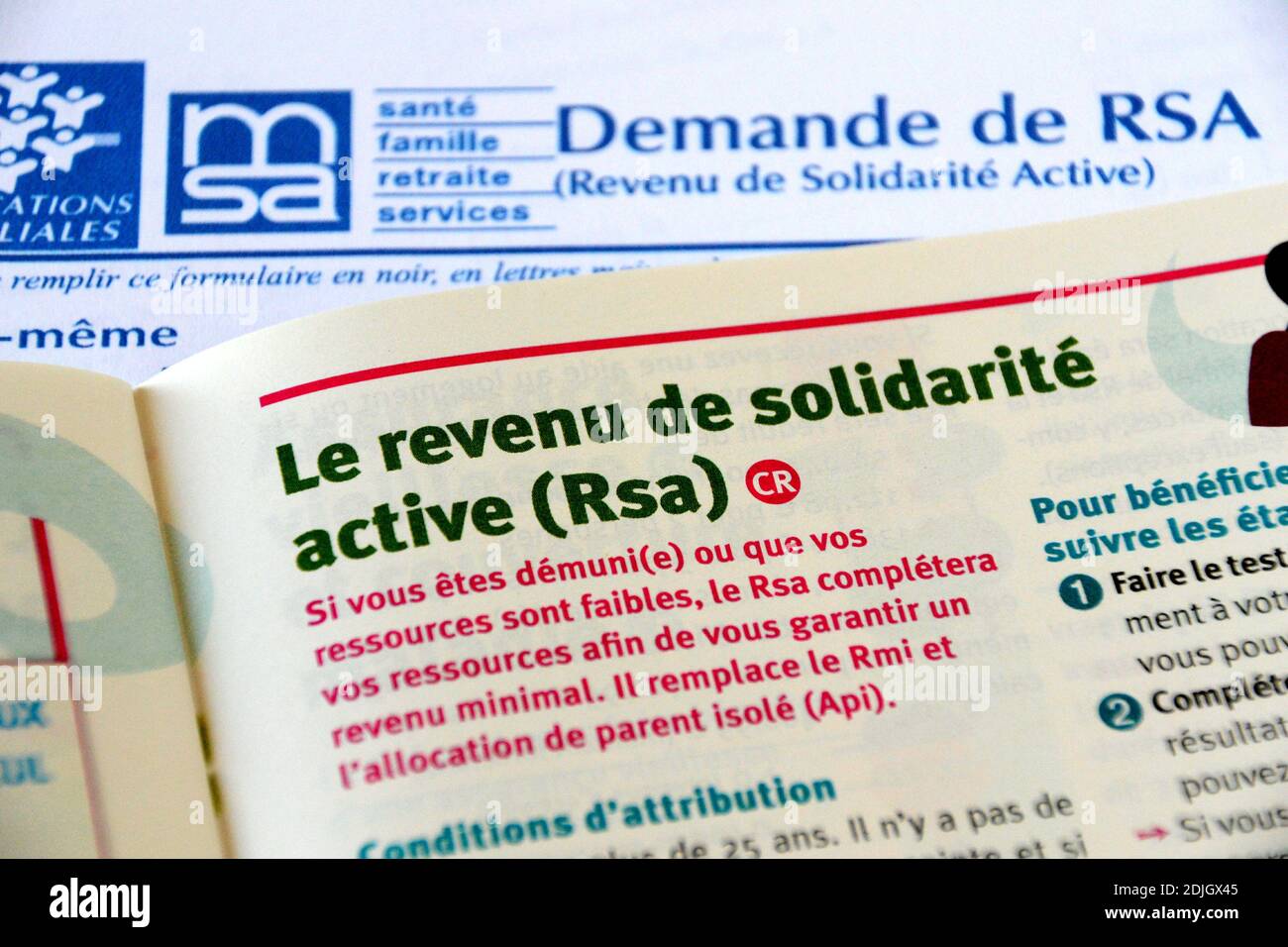 France. 14th Dec, 2020. In this photo illustration, a press article is placed on 'Revenu de Solidarite Active' (RSA) request form.Linked to the Covid-19 pandemic, the increase in beneficiaries of the 'Revenu de Solidarite Active' (RSA) was estimated at 8.5% for the year 2020, in France. Credit: SOPA Images Limited/Alamy Live News Stock Photo