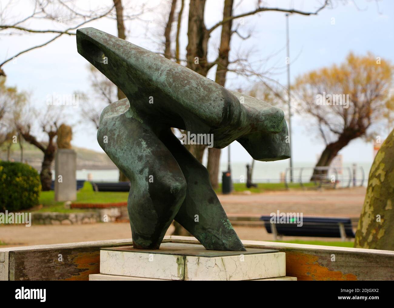 Bronze sculpture of a figure in the act of throwing a ball in the Spanish game of bowling Los Bolos Mesones Park Sardinero Santander Cantabria Spain Stock Photo