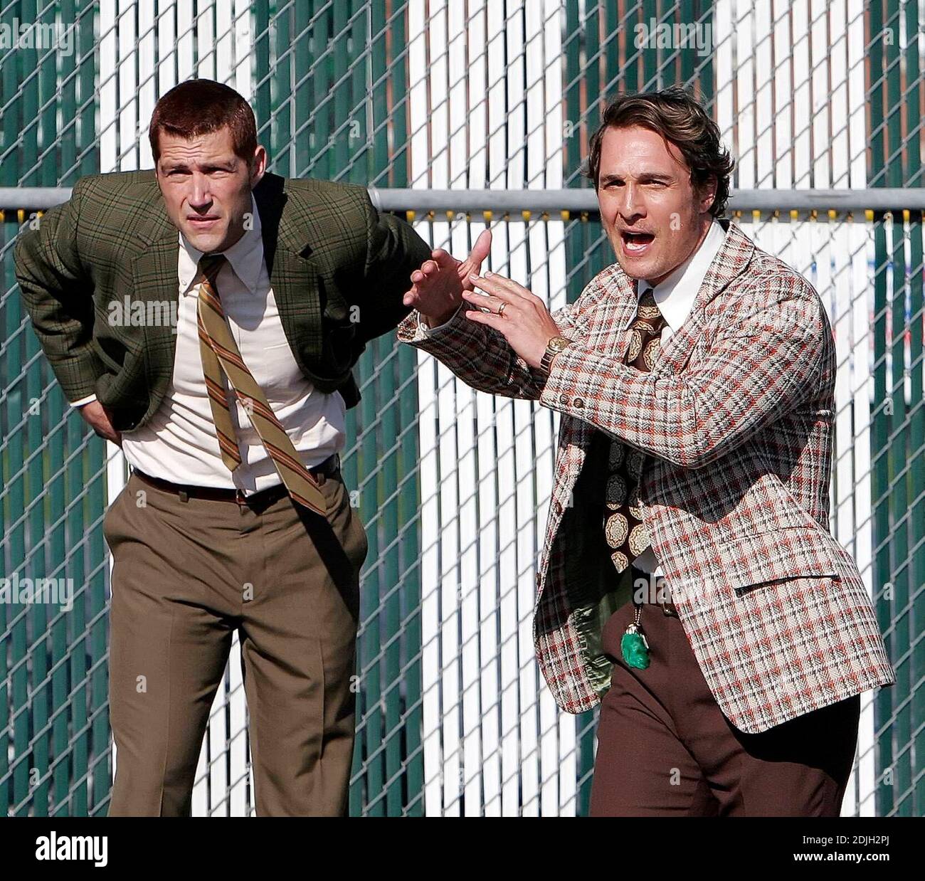 Exclusive!! Matthew Fox, left, portraying former Marshall assistant coach  Red Dawson stand by as Matthew McConaughey portraying former head football  coach Jack Lengyel calls timeout during a scene while filming the 