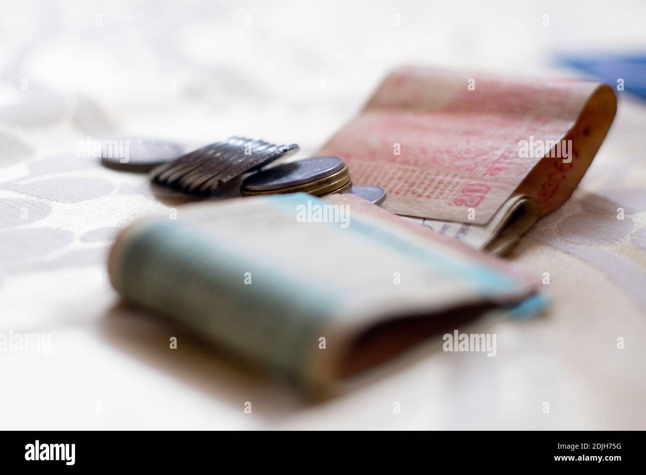 Indian currency rupee notes and coins placed on table showing payments ...