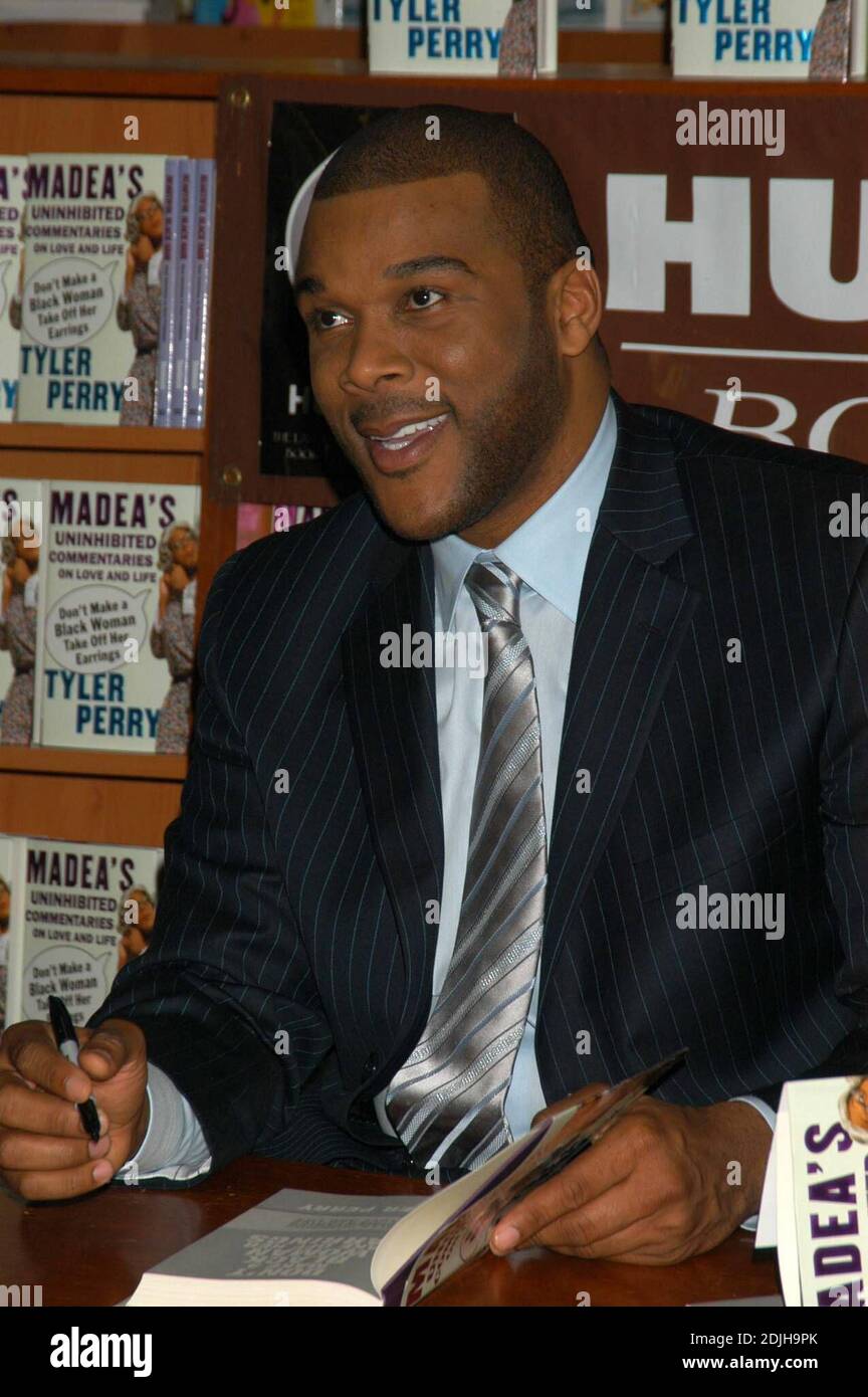 Tyler Perry, author of Don't Make a Black Woman Take Off Her Earrings,  treats fans to a book signing at the Hue-Man Bookstore. This first-time  novelist is also the beloved comedian known