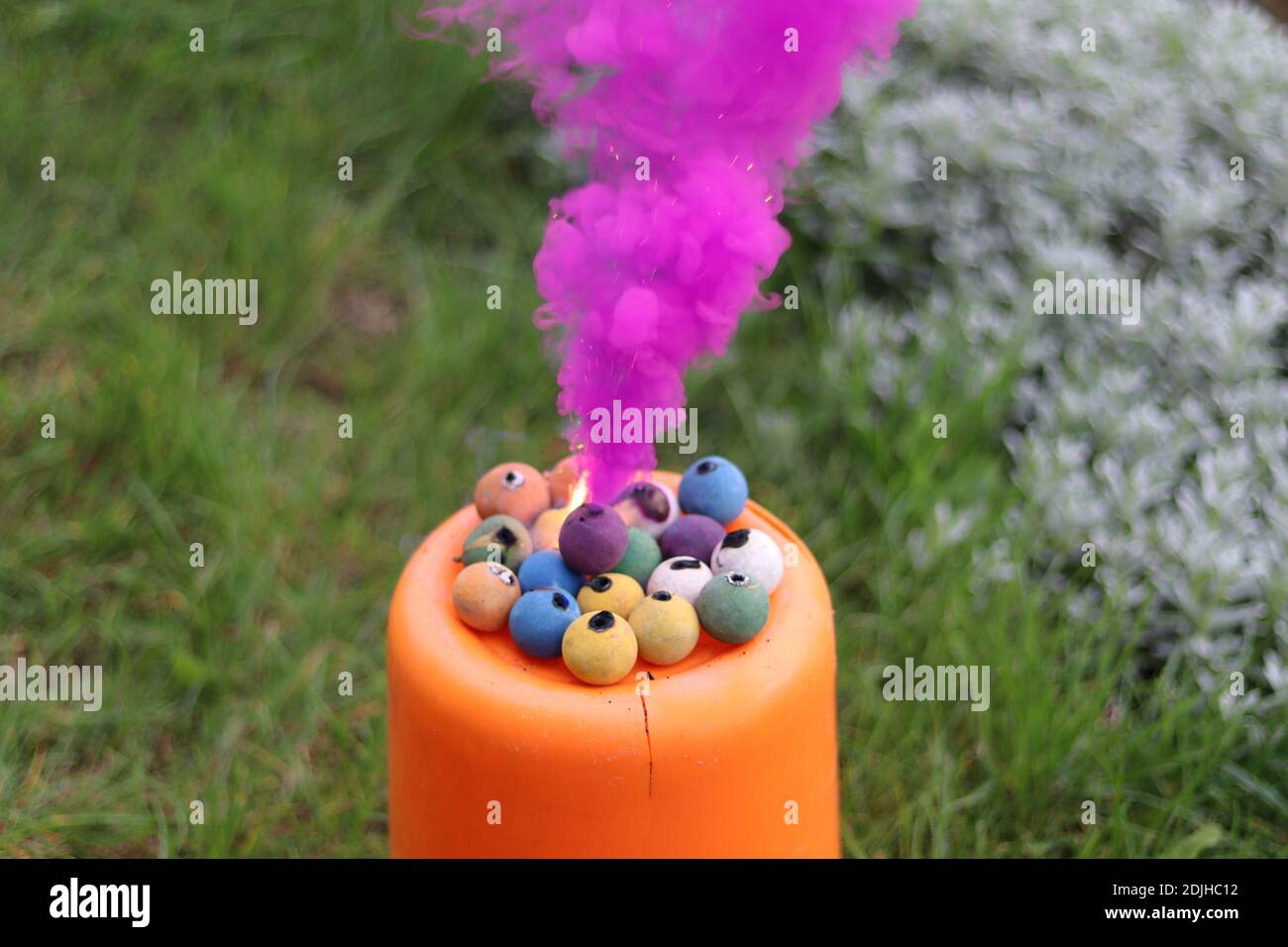 View of an colored smoke from fire balls Stock Photo