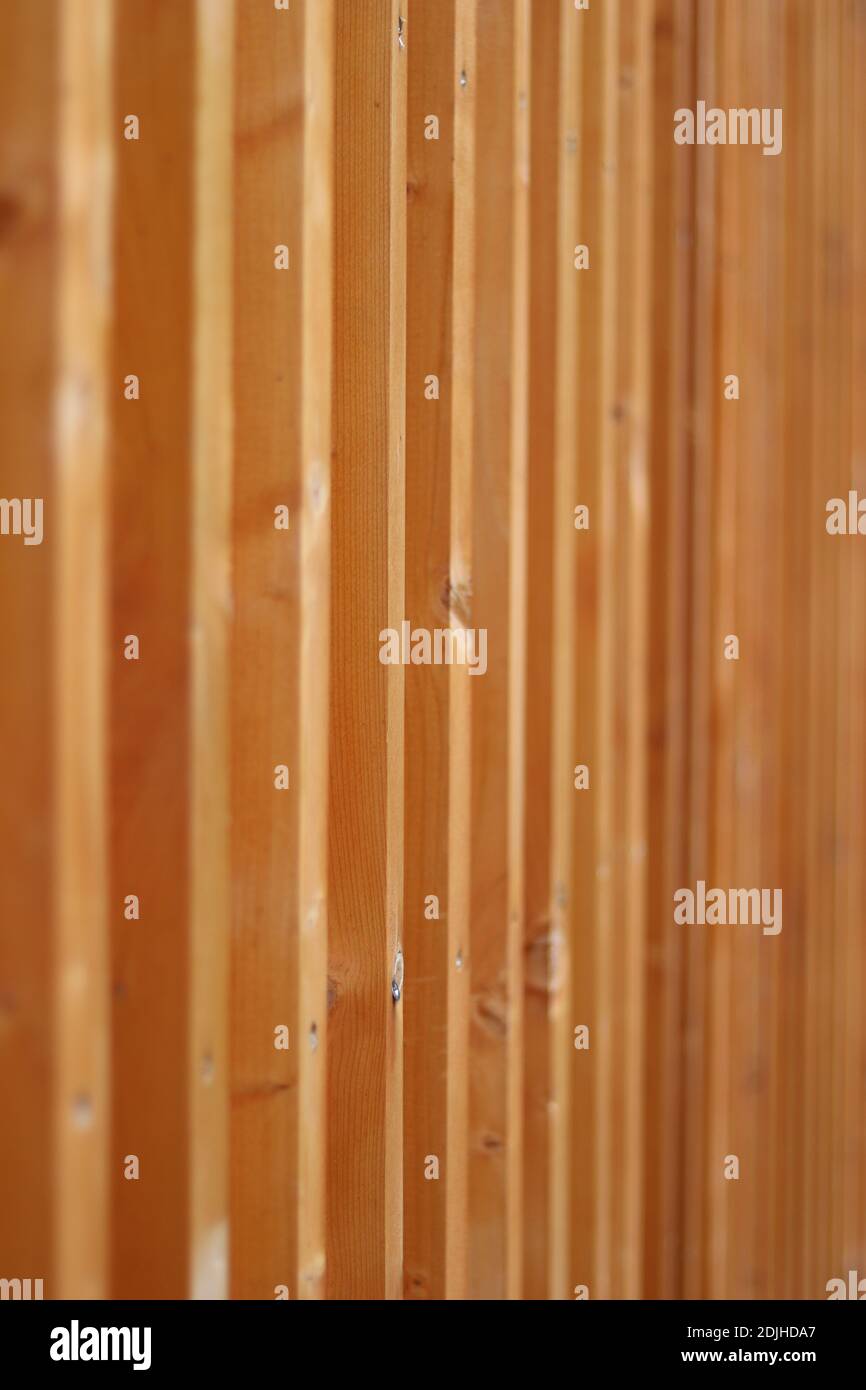 Closeup view of a wall made of wooden posts Stock Photo - Alamy