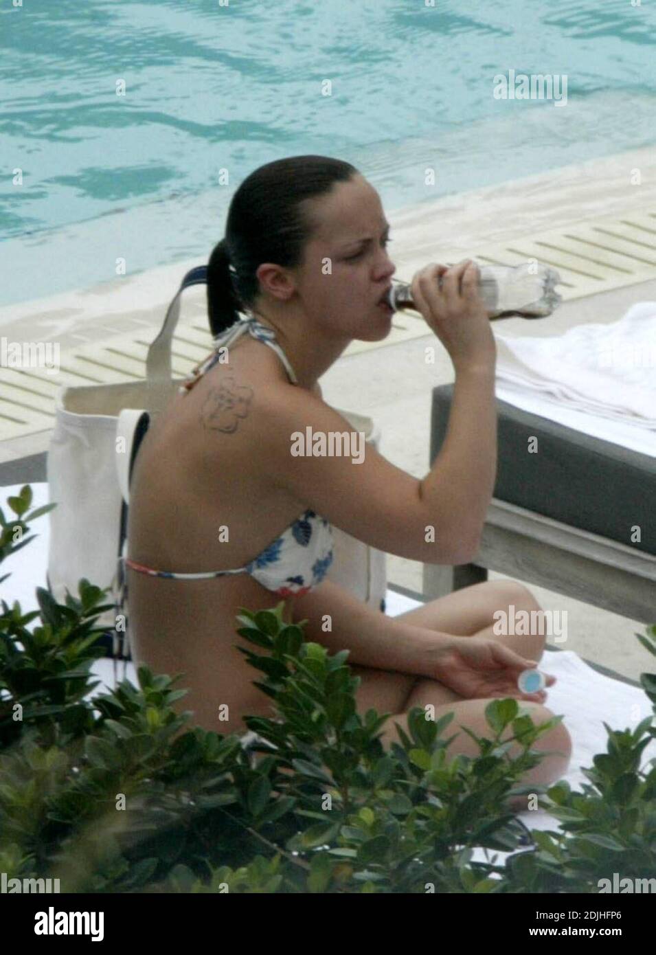Exclusive!! Christina Ricci spends an afternoon poolside at a Miami Beach hotel. The actress spent the day with five girlfriends, drank, smoked, swam, clowned around and chatted to handsome pool attendants.  5/12/05 Stock Photo