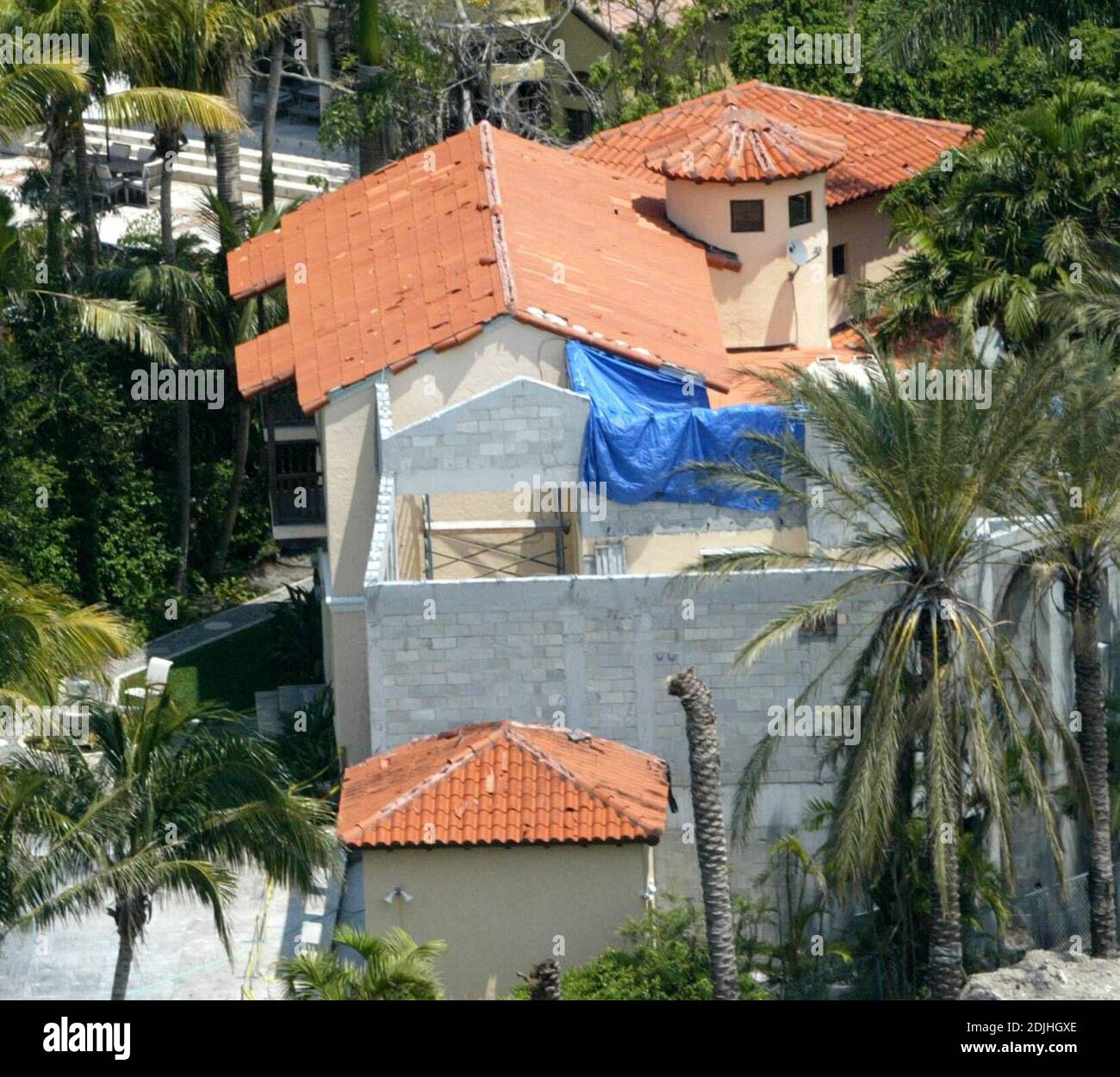 Exclusive!! Alejandro Sanz is having an extension put on his Miami mansion. The roof also still shows signs of damage by last years hurricane, 4/19/06 Stock Photo