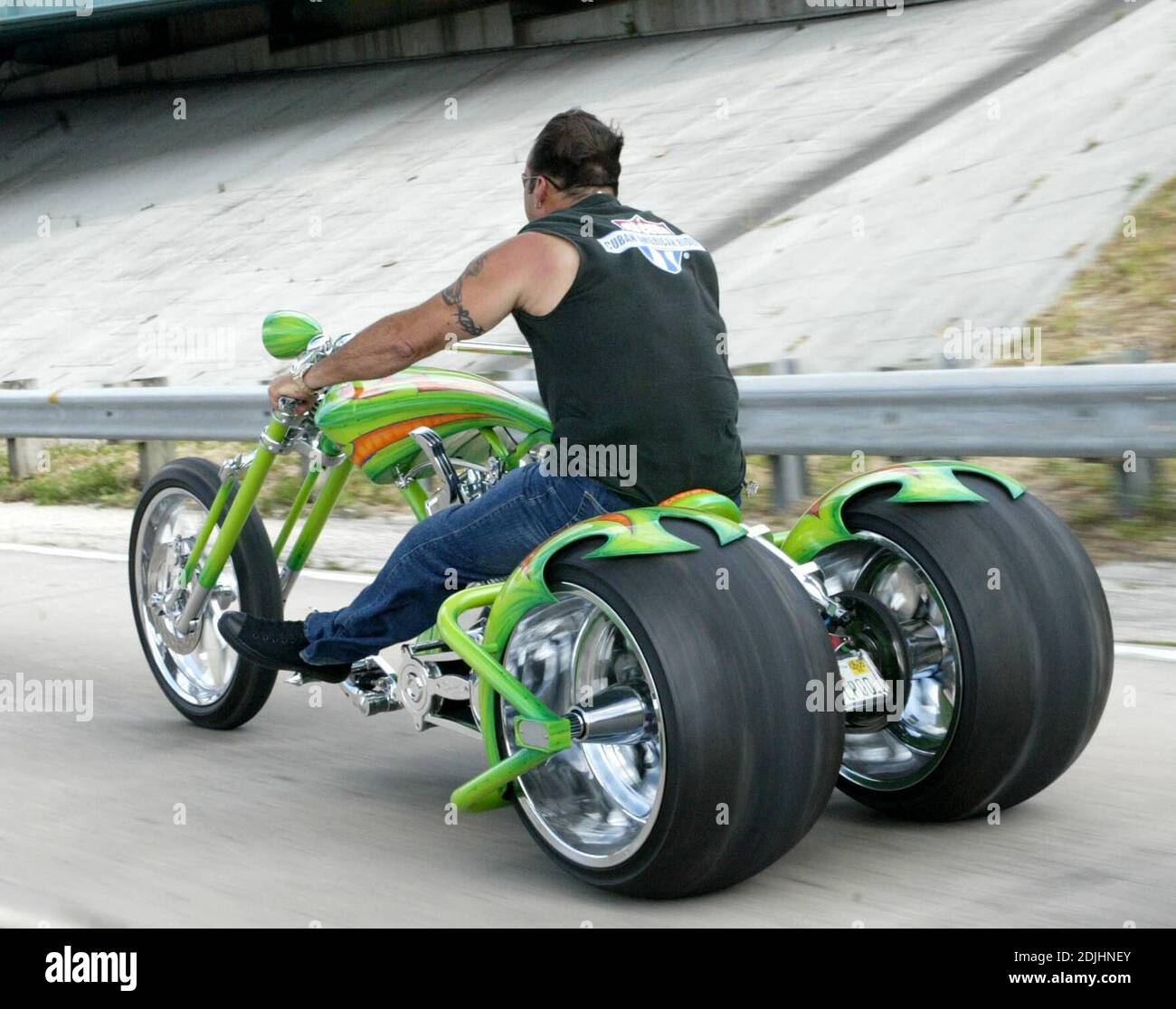 Exclusive!! The quest to build the most extreme choppers is alive and well in the USA. Chop Shops like West Coast Choppers and Orange County Choppers are constantly competing  to build the coolest bikes. This "Super Trike" was spotted on a Miami freeway, but when our photographer waved him over to find out more about this outrageous machine, the rider simply dropped a gear on his "suicide shift" and disappered to the horizon, Miami, FL, 4/22/06 Stock Photo
