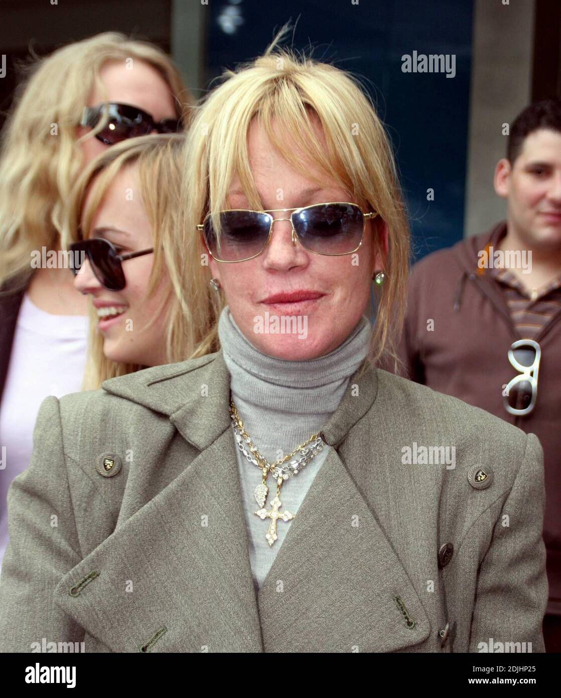 After a crowd formed outside Kitson clothing store in Los Angeles to see Melanie Griffith, the actress seized the moment to do some PR for her son Alexander Bauer's rock band 'Slander' by handing out flyers for his next concert on May 3 2006 at The Gig in Los Angeles, Ca.  4/22/07. Stock Photo