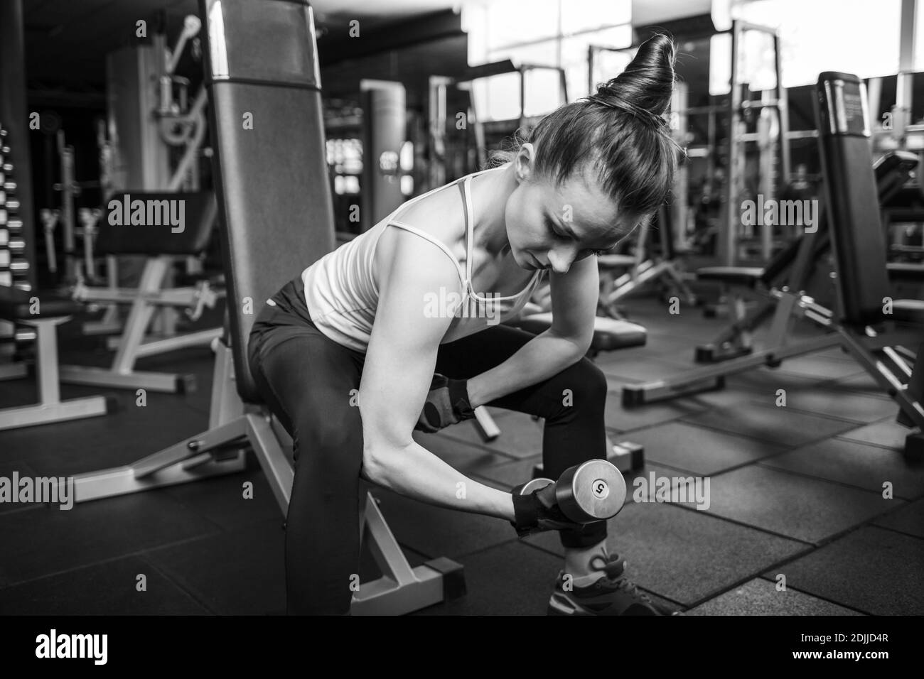 Young fitness woman doing training in the gym Stock Photo