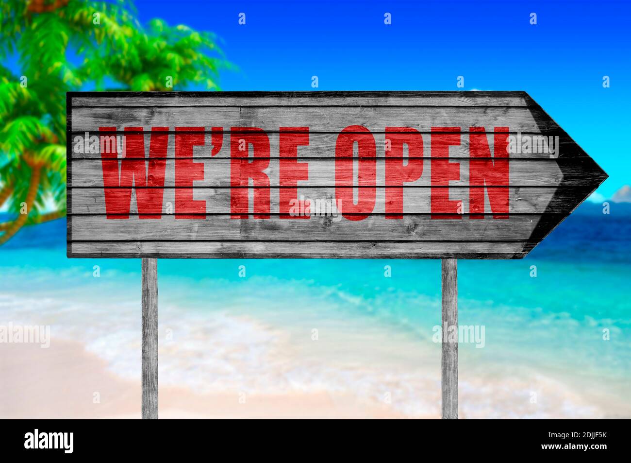 Red We're open wooden sign with on a beach background Stock Photo - Alamy