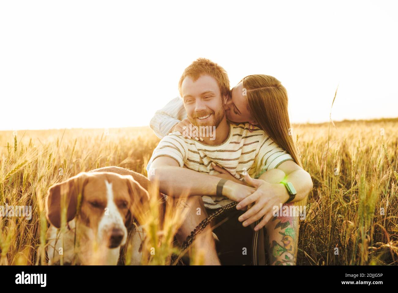 Image of a young happy cheery loving couple hugging outside at the ...