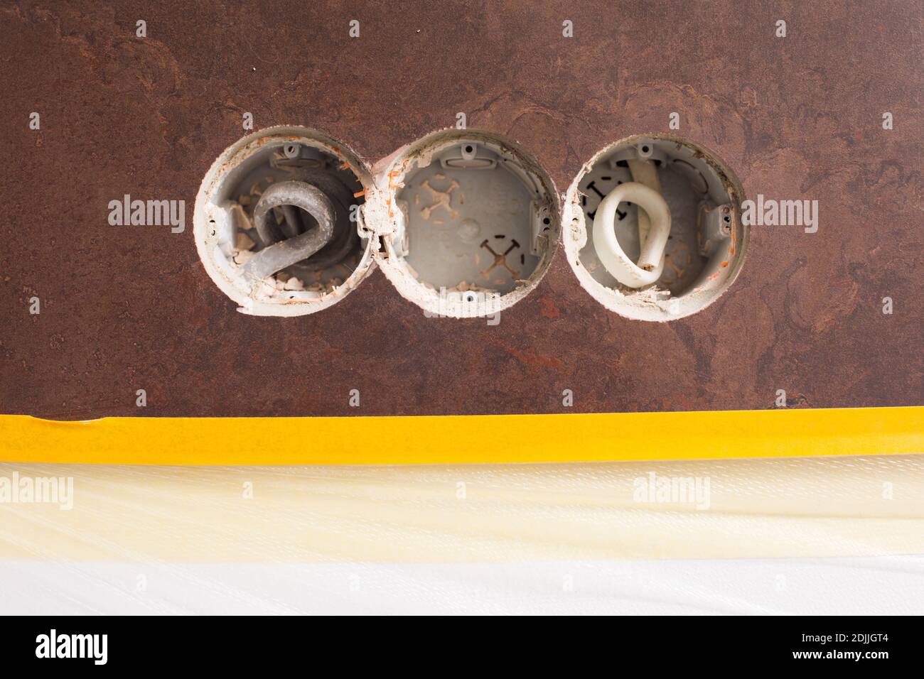 Three holes in the wall for new sockets Stock Photo
