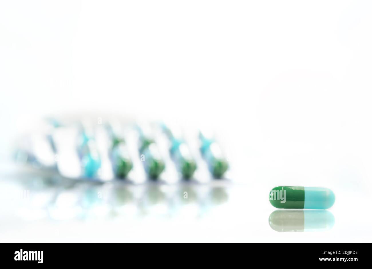 Close-up Of Capsule And Blister Pack Over White Background Stock Photo