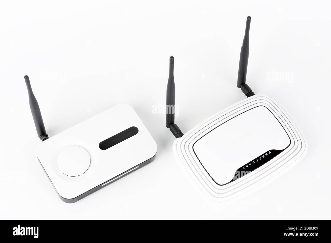 Two wifi routers, wireless devices with one and two antennas on white