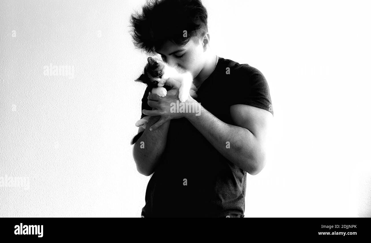 Man holding cat Black and White Stock Photos & Images Alamy
