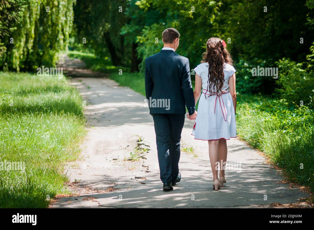 Girl guy holding hands walking hi-res stock photography and images - Alamy