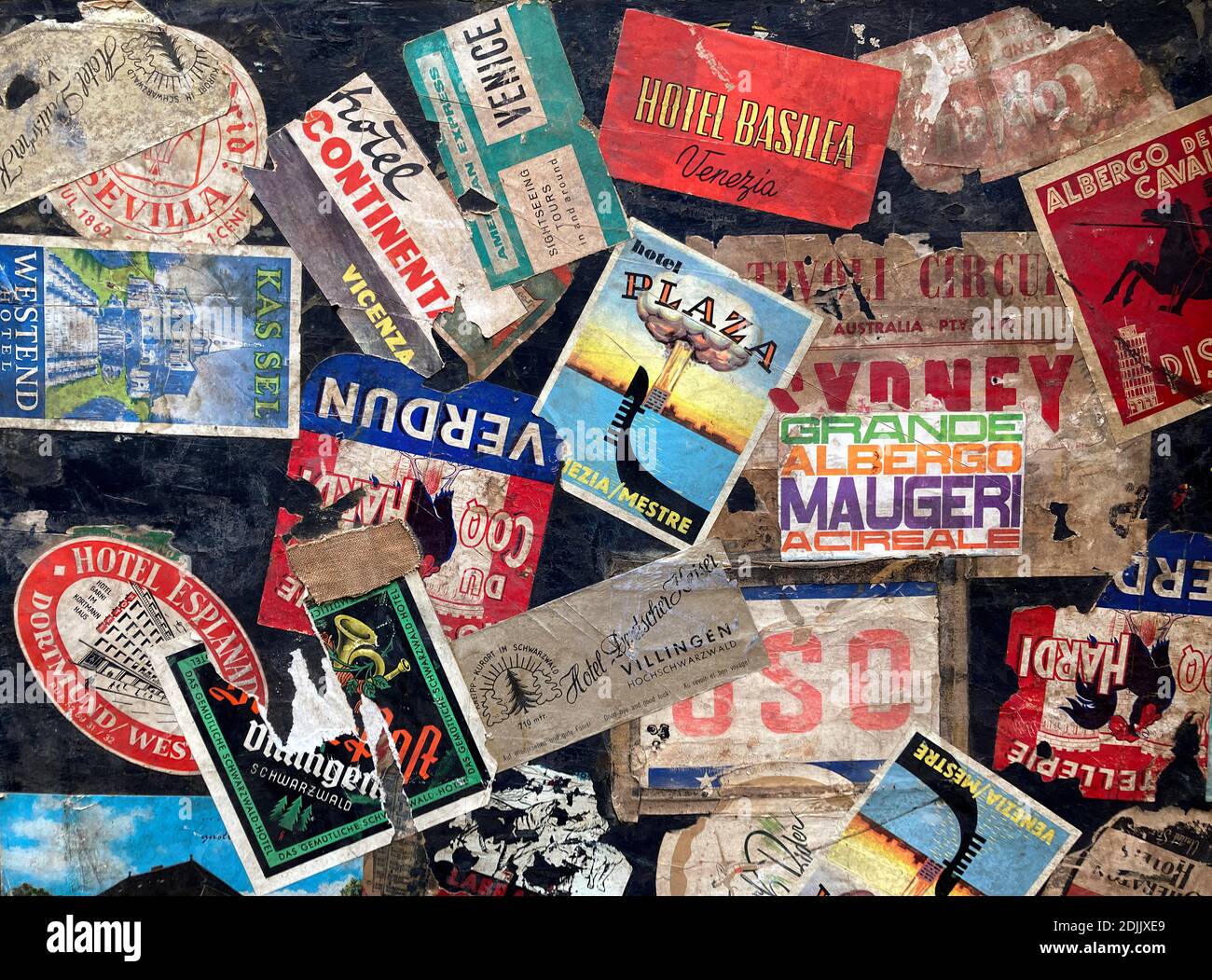 Vintage Luggage Labels on a Suitcase Stock Photo