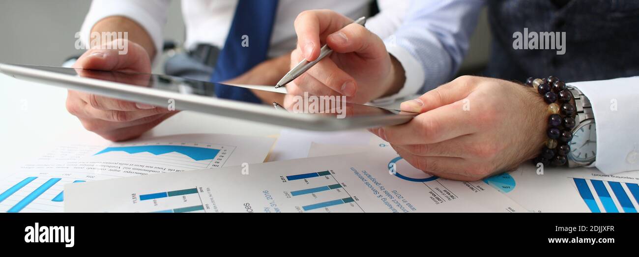 Business colleagues using digital tablet computer at work Stock Photo ...