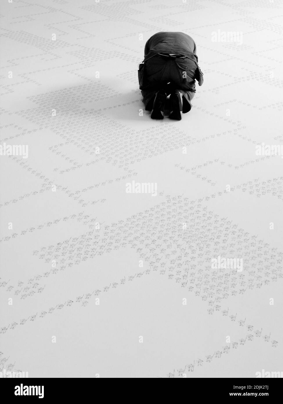 Kneeling man rear view Black and White Stock Photos & Images - Alamy