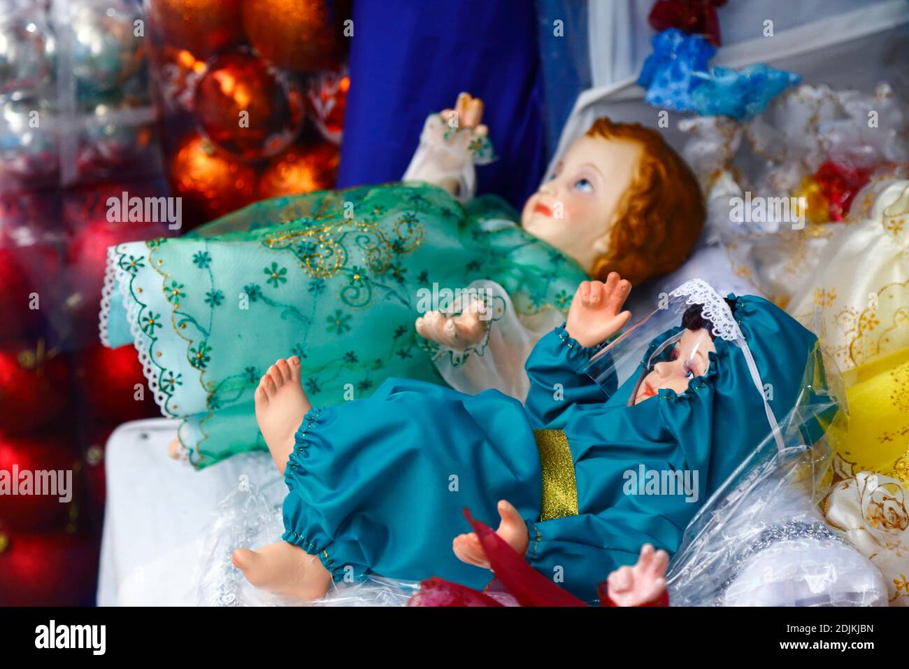 14th December 2020, LA PAZ, BOLIVIA: Baby Jesus figure (called Niño in Spanish) for nativity scenes wearing face mask and protective clothing against the covid 19 coronavirus on sale in a Christmas market. Nativity scenes are an important Christmas decoration in houses and public places in Latin America, and also Spain (where the tradition comes from).  Large numbers of figurines for nativity scenes are sold in Christmas markets; niños wearing protection against the covid 19 coronavirus are a new option this year alongside traditionally dressed niños as a result of the pandemic. Stock Photo