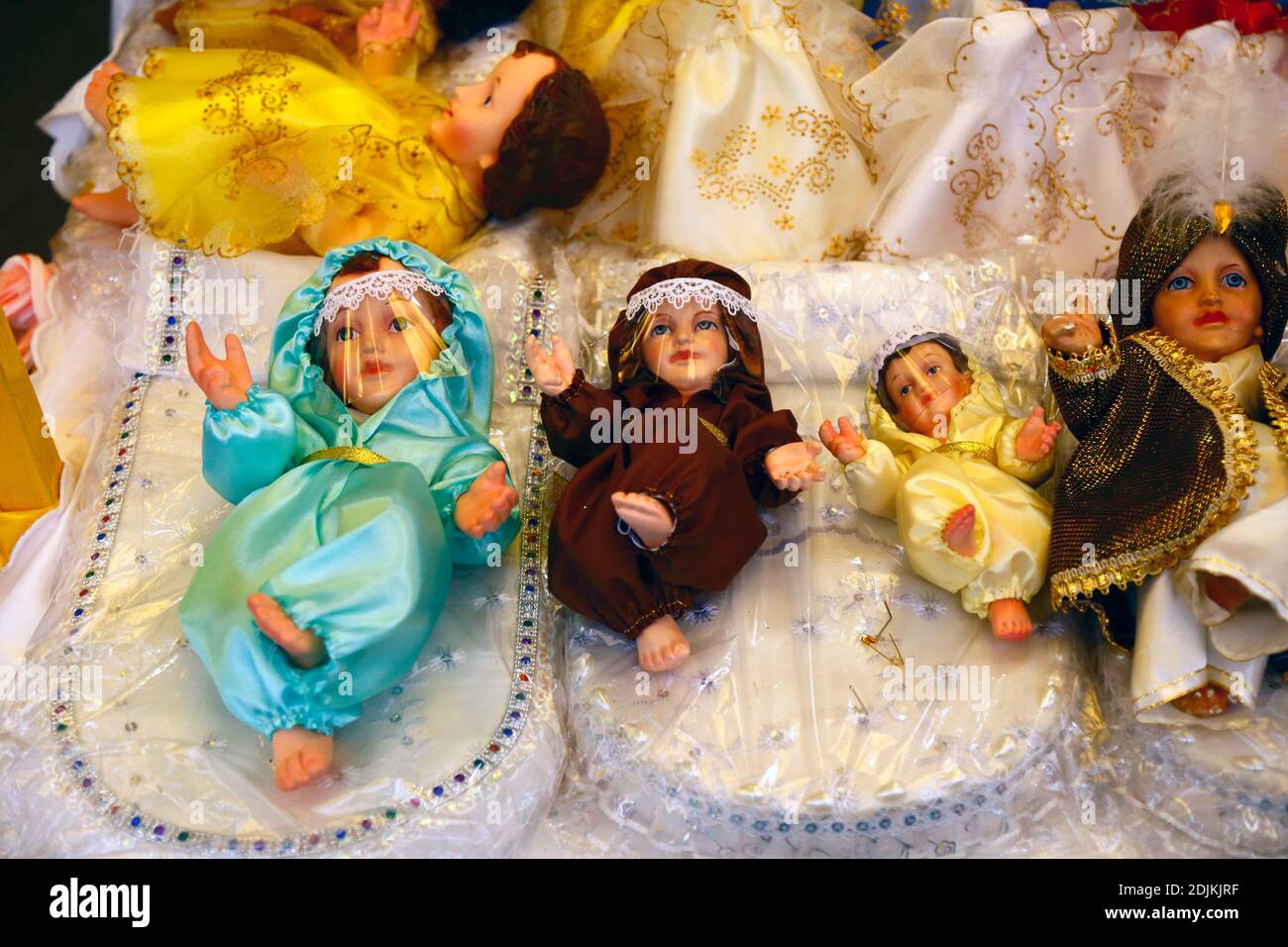 14th December 2020, LA PAZ, BOLIVIA: Baby Jesus figures (called Niños in Spanish) for nativity scenes wearing face masks and protective clothing against the covid 19 coronavirus on sale in a Christmas market. Nativity scenes are an important Christmas decoration in houses and public places in Latin America, and also Spain (where the tradition comes from).  Large numbers of figurines for nativity scenes are sold in Christmas markets; niños wearing protection against the covid 19 coronavirus are a new option this year alongside traditionally dressed niños as a result of the pandemic. Stock Photo