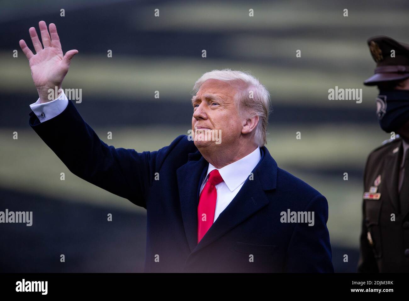U.S. President Donald Trump waves as he arrives along the side-lines to visit with Army fans at the 121st Army-Navy football game at Michie Stadium December 12, 2019 in West Point, New York. The Army Black Knights shutout the Navy Midshipmen 15-0. Stock Photo