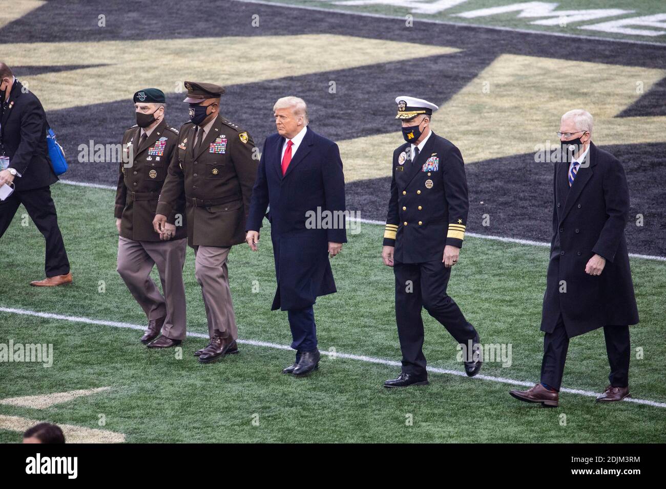 U.S. President Donald Trump walks out for the coin toss to start the 121st Army-Navy football game at Michie Stadium December 12, 2019 in West Point, New York. Walking alongside the president are left to right: Chairman of the Joint Chiefs Gen. Mark Milley, Lt. Gen. Darryl Williams, Superintendent of the U.S. Military Academy, Adm. Sean Buck, Superintendent of the U.S. Naval Academy and Acting Defense Secretary Christopher Miller. Stock Photo