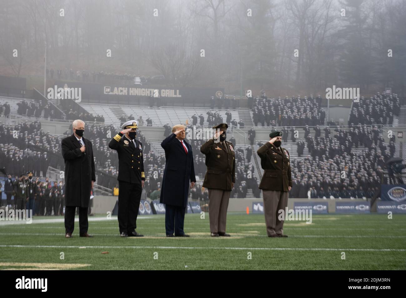 U.S. President Donald Trump stands for the national anthem at the start the 121st Army-Navy football game at Michie Stadium December 12, 2019 in West Point, New York. Standing with the president are left to right: Acting Defense Secretary Christopher Miller, Adm. Sean Buck, Superintendent of the U.S. Naval Academy, President Donald Trump, Lt. Gen. Darryl Williams, Superintendent of the U.S. Military Academy and Chairman of the Joint Chiefs Gen. Mark Milley. Stock Photo