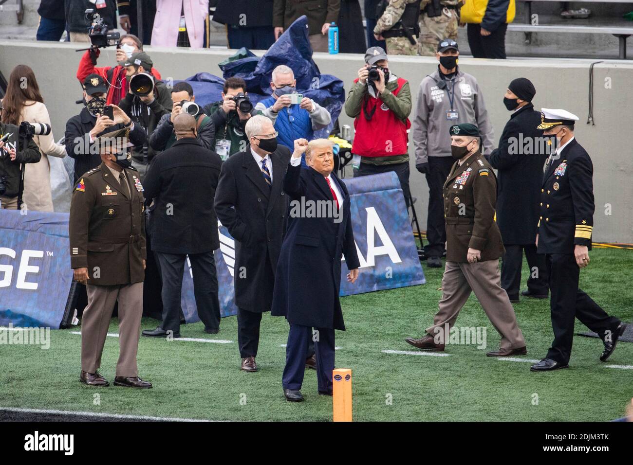 U.S. President Donald Trump waves as he arrives for the 121st Army-Navy football game at Michie Stadium December 12, 2019 in West Point, New York. The Army Black Knights shutout the Navy Midshipmen 15-0. Stock Photo