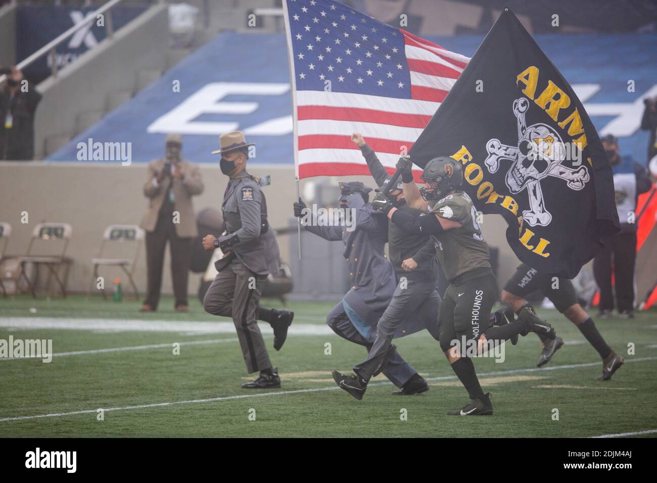 U.S. Navy midshipmen and Army Black Knights take the field at the start of the 121st Army-Navy football game at Michie Stadium December 12, 2019 in West Point, New York. The Army Black Knights shutout the Navy Midshipmen 15-0. Stock Photo