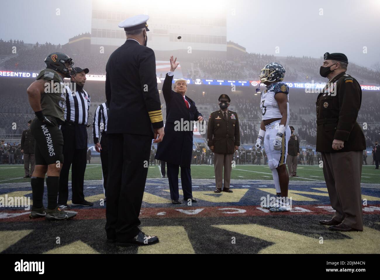 U.S. President Donald Trump tosses the coin toss at the start the 121st Army-Navy football game at Michie Stadium December 12, 2019 in West Point, New York. The Army Black Knights shutout the Navy Midshipmen 15-0. Stock Photo