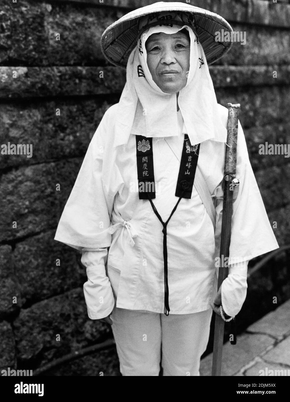 female pilgrim at Koyasan. Woman with straw hat , Koyasan , Mount Koya, Japan Stock Photo