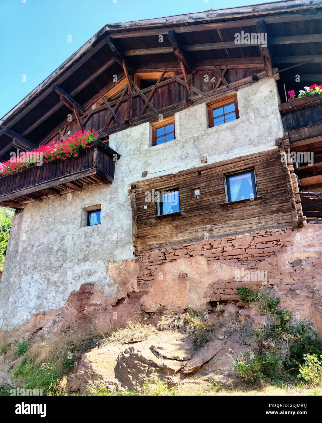 Old South Tyrolean house in Mölten was built on a rock, Meraner Land Stock Photo