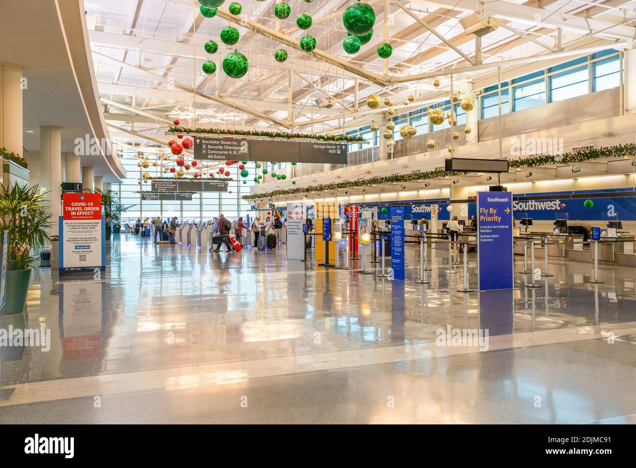 The Southwest check in at Midway International Airport where people can check their bags at kiosks before going to security during the pandemic. Stock Photo